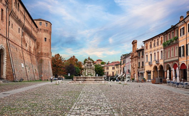 Cesena, Emilia-Romagna, Italy: landscape of the ancient square Piazza del Popolo with the fortified palace Rocchetta di Piazza and the fountain Fontana del Masini in the old town of the city
