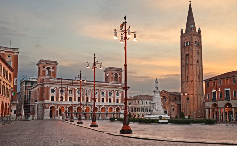 Forli, Emilia-Romagna, Italy: cityscape of the main square Aurelio Saffi with the ancient abbey of San Mercuriale and the post office building of 1932