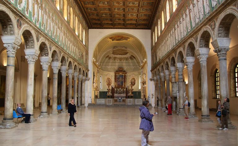 Ravenna, Italy - April 14, 2018: Inside the medieval Basilica di Santâ€™Apollinare in Ravenna, built in the 5th century. Famous  particularly for its wall mosaics. Italy, South Europe