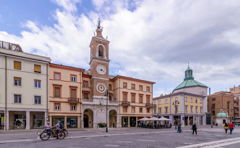 The central Piazza Tre Martiri square and the clock tower in the historic center of Rimini, Emilia Romagna, Italy