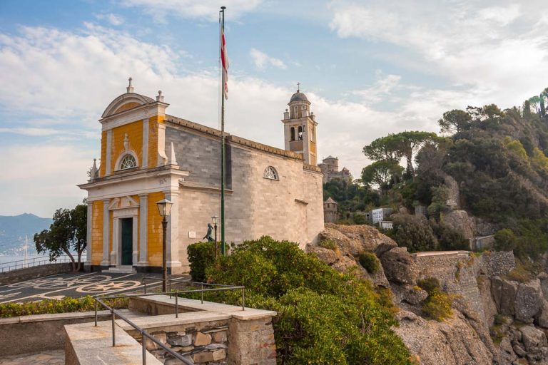 Church of San Giorgio in Portofino, a fishing village located on the coast of the Italian Riviera, southeast of Genoa, with its pastel-colored houses, luxury boutiques, seafood restaurants and superya