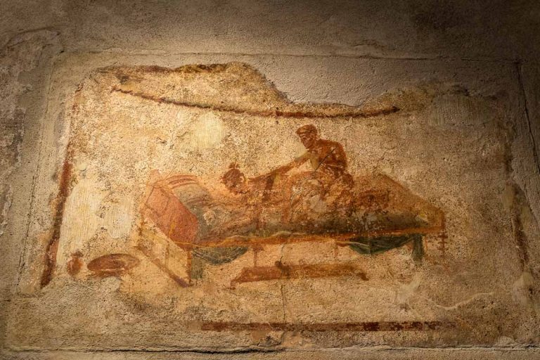 Sexual scene from a wall painting at the Lupanare, the most famous brothel in Roman city of Pompeii, Italy