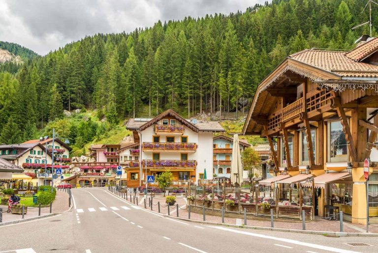 CANAZEI,ITALY - SEPTEMBER 18,2016 - In the streets of Canazei mountain town. Canazei is the base station for many excursions and rock climbs to the Sella, Marmolada and Sassolungo Groups.