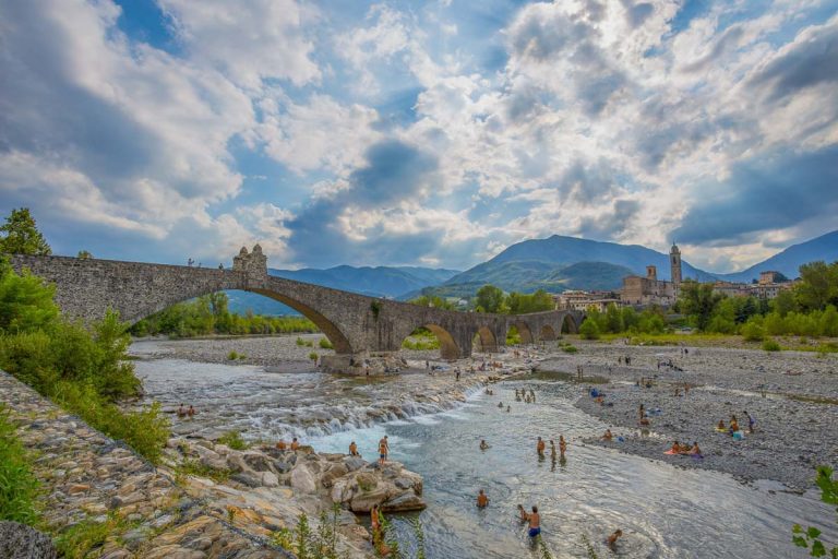 BOBBIO, ITALY, AUGUST 20, 2020 - The "Old" Bridge" or "Gobbo Bridge" also "Devil Bridge" in Bobbio, Piacenza province, Trebbia Valley, Emilia Romagna, Italy.