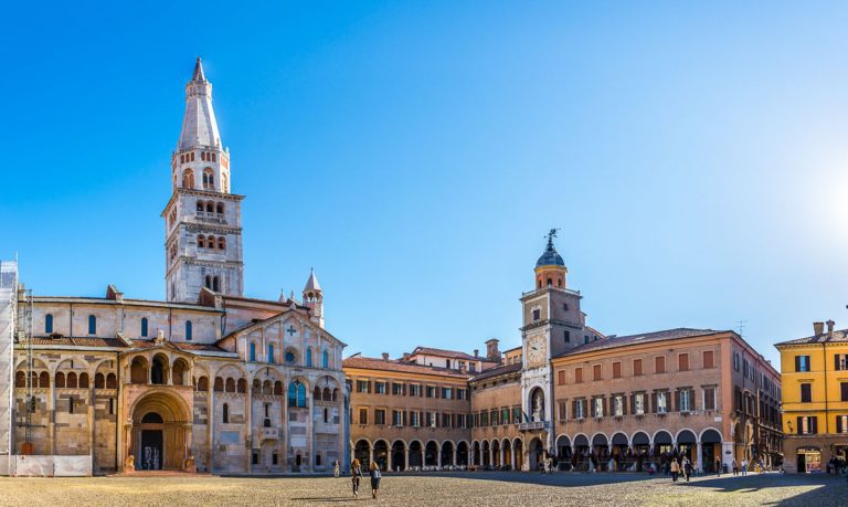 MODENA,ITALY - SEPTEMBER 25,2018 - View at the Grande place with Cathedral tower Ghirlandina and City hall in Modena. Modena is also known in culinary circles for its production of balsamic vinegar.