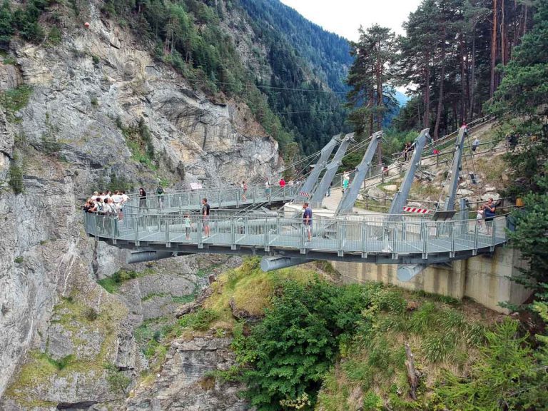 Pre-Saint-Didier, Aosta / Italy - 08/18/2018: Footbridge suspended over the gorge of Pre-Saint-Didier park