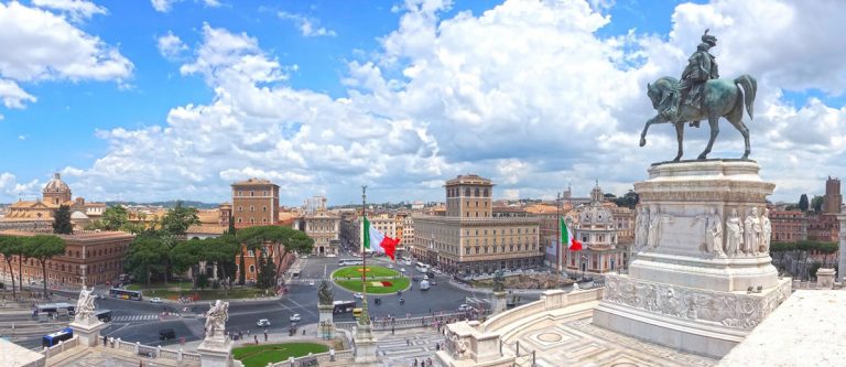 Piazza Venezia, view from Vittoriano (The Altare della Patria). Panorama of Rome. Italian flags. Statue of Victor Emmanuel II