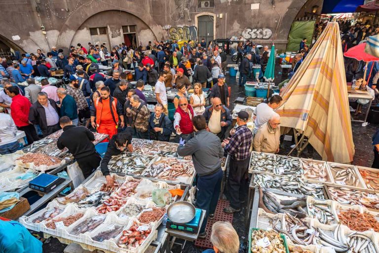 Catania, Italy - May 11, 2019: La Pescheria, the famous historical fish market in Catania, Sicily.