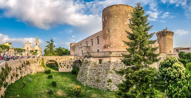 Panoramic view of the historic town of Venosa with famous Aragonese Castle (Castello Aragonese) in golden evening light, Basilicata, southern Italy