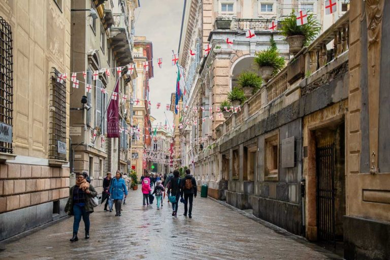 Genoa / Italy - April 23 2019: Street view of Via Giuseppe Garibaldi in the historic centre of the city, built by the Genoese aristocracy during the Renaissance and famous for its ancient palaces