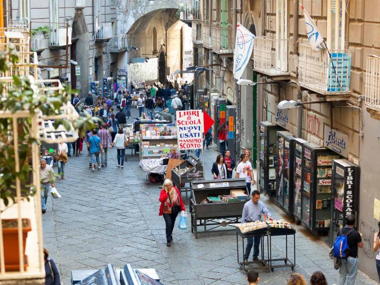 Naples, Italy - October 10, 2013: Port'Alba is an ancient city gate of Naples, located on the left side of the House of Piazza Dante.  It's is famous for the shops selling books and music.