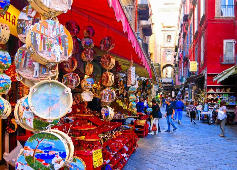 NAPLES, ITALY 20.05.2016. The big souvenir and statues colorful market on Via San Gregorio Armeno full of tourists in Naples.