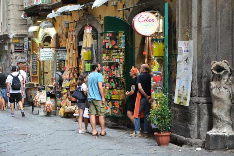 NAPLES, ITALY - AUGUST 22, 2018: Cafes, bars, restaurants and shops on Via Benedetto Croce