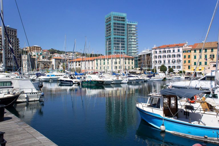 Savona/Italy-April 21,2018:Savona    old sea port city center view with fishing boats and houses italy liguria mediterranean sea travel tourism