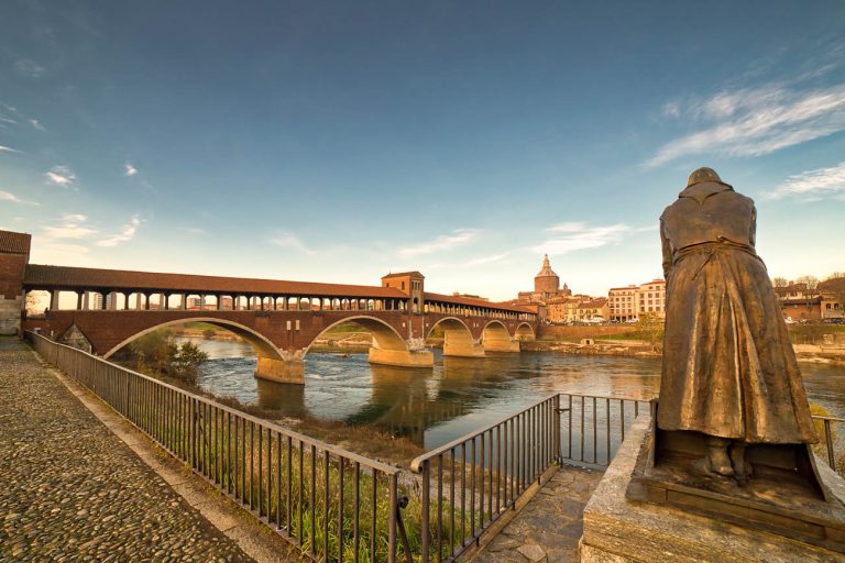 covered bridge  over the flowing waters of the Ticino river  in Pavia in Italy